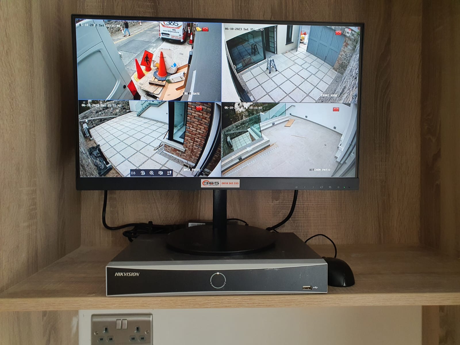 365 CCTV monitor and HIKVISION DVR showing live camera footage