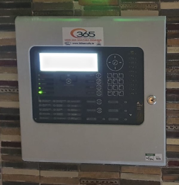 365 Fire & Security addressable fire alarm control panel installed on a wall